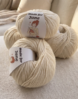 Yarn with personalized labels. Ivory